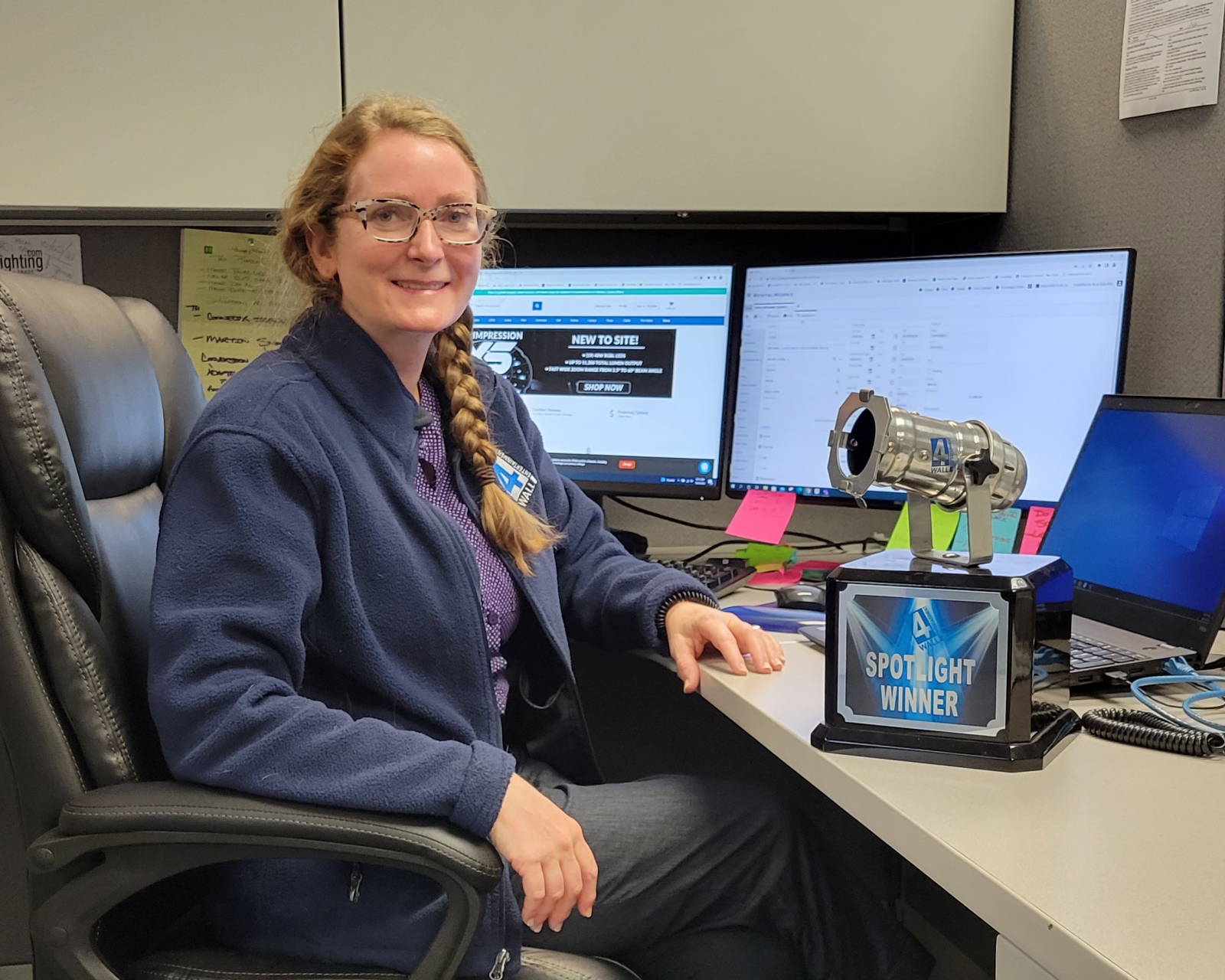 Shannon sitting at desk with Spotlight