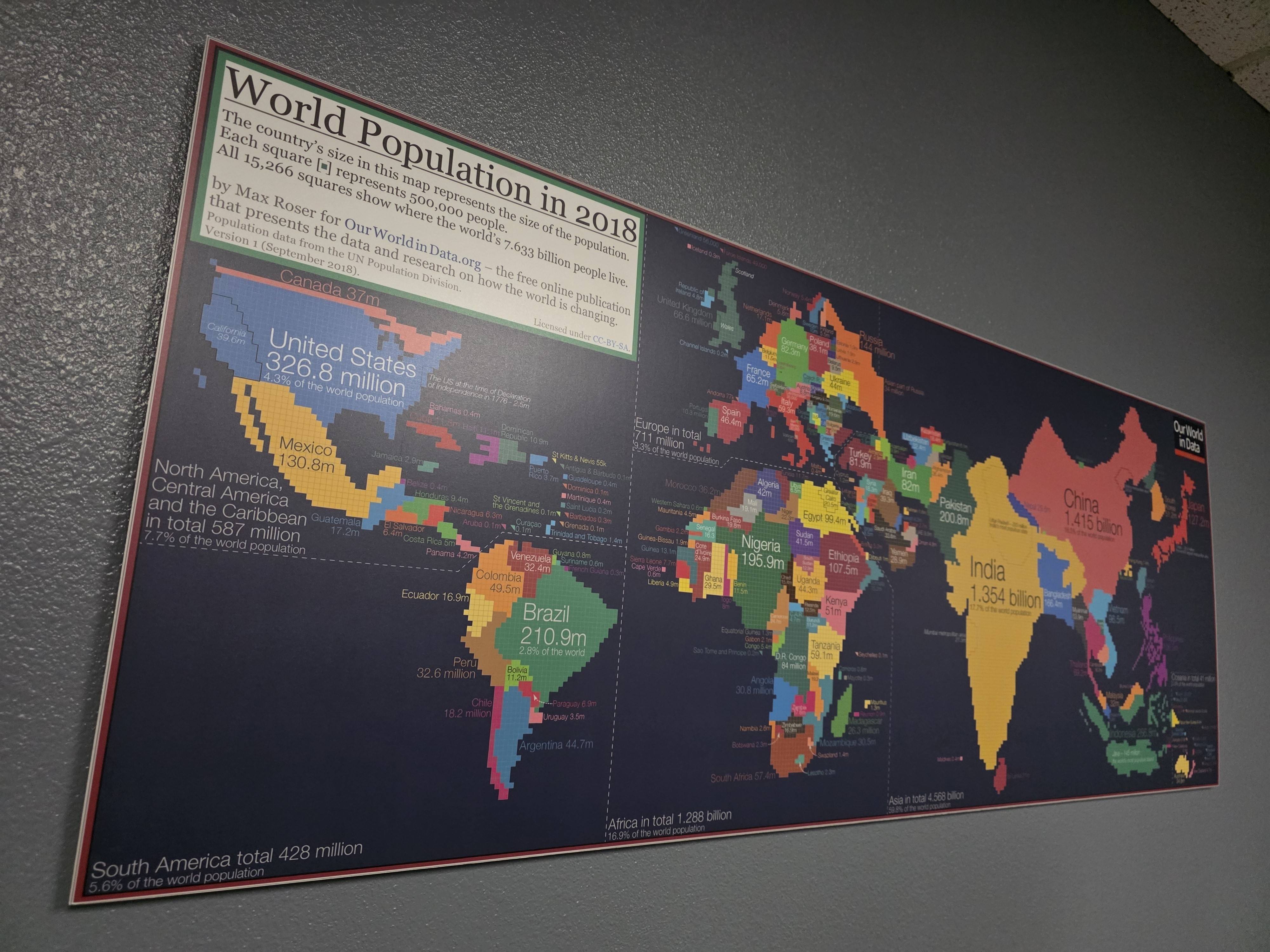 A world map with squares representing 500,000 people.
